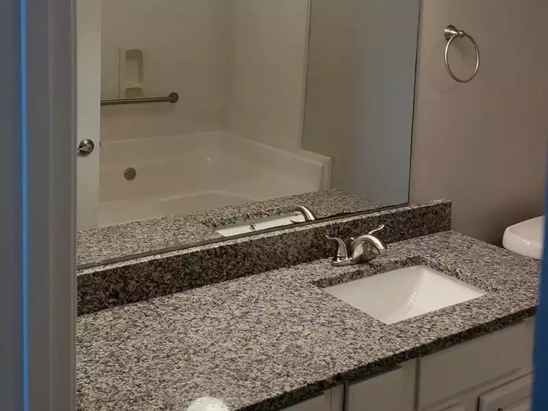 Renovated Bathroom Counter | The Grove Apartments in Biloxi, MS