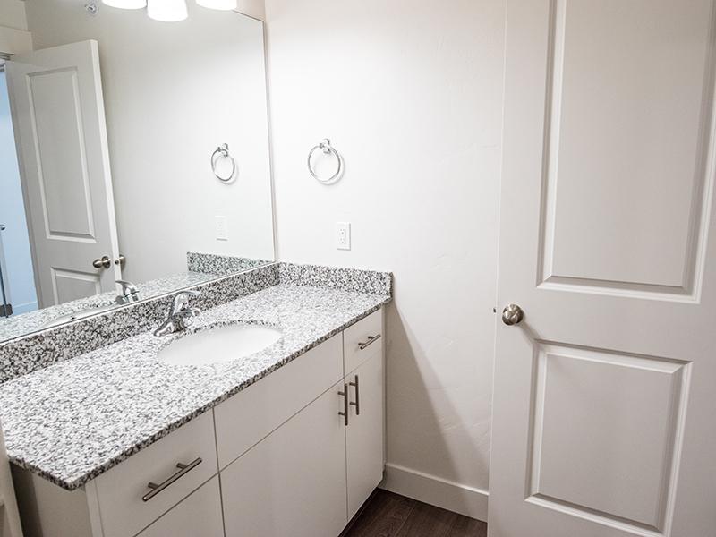 Bathroom with White Cabinets | Trail Hollow Apartments in West Haven, UT