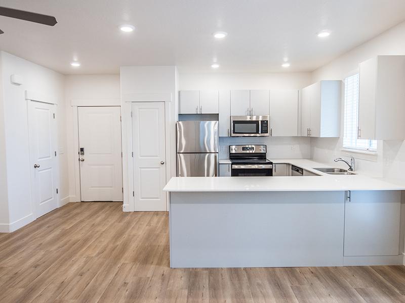 Kitchen with Stainless Steel Appliances | Trail Hollow Apartments in West Haven, UT