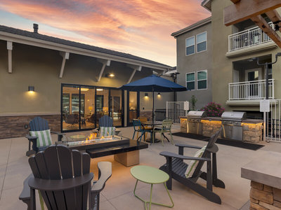 Grill and Fire Pit Area | Vela Apartments