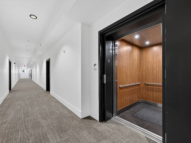 Hallway with Elevator Access | Village Apartments