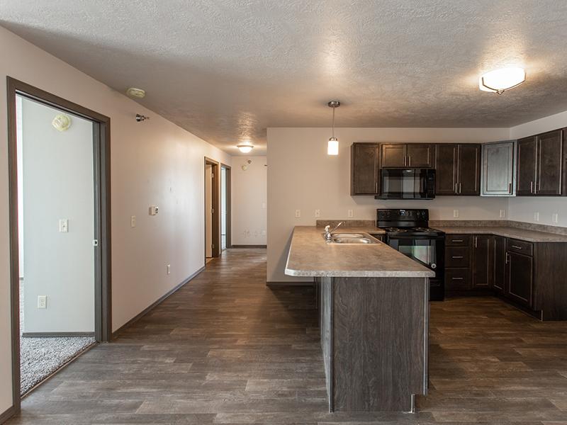 Kitchen and Hallway | Whisper Ridge Apartments in Sioux Falls, SD